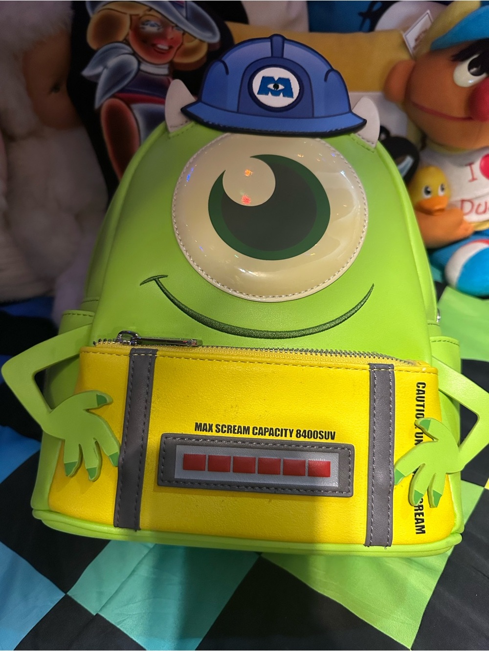 Loungefly Monsters Inc Green Backpack with Yellow Front Scream Canister Pocket